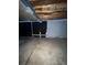 Unfinished basement area with some built-in shelving at 3658 S Norfolk Way, Aurora, CO 80013