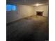 Spacious basement with fireplace and neutral carpeting at 3658 S Norfolk Way, Aurora, CO 80013