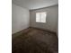 Small bedroom with brown carpet and window at 3658 S Norfolk Way, Aurora, CO 80013