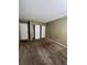 Primary bedroom with double door closet and brown carpet at 3658 S Norfolk Way, Aurora, CO 80013
