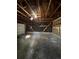 Empty garage with concrete floor and shelving at 3658 S Norfolk Way, Aurora, CO 80013