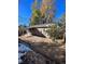 Rear view of house showing a covered patio and yard at 3658 S Norfolk Way, Aurora, CO 80013