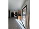Kitchen with access to backyard, wood cabinets, and tile flooring at 3658 S Norfolk Way, Aurora, CO 80013