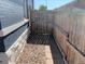 Side yard with gravel and wooden fence at 523 W 8Th Ave, Denver, CO 80204