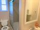 Clean bathroom with shower/tub combo and a mirror at 523 W 8Th Ave, Denver, CO 80204