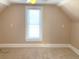 Well-lit bedroom with carpet and a window at 523 W 8Th Ave, Denver, CO 80204