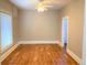 Spacious bedroom with hardwood floors and a ceiling fan at 523 W 8Th Ave, Denver, CO 80204