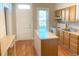 Efficient kitchen featuring wood cabinets and an island at 523 W 8Th Ave, Denver, CO 80204