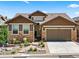 Two-story home with landscaped front yard and two-car garage at 6210 Dakota Ridge Dr, Littleton, CO 80125