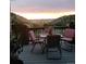 Deck with table and chairs overlooking scenic view at 6210 Dakota Ridge Dr, Littleton, CO 80125