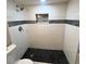 Clean basement shower with pebble floor and tile surround at 4185 S Logan St, Englewood, CO 80113