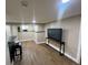 Finished basement features a bar area, TV, and ample living space at 4185 S Logan St, Englewood, CO 80113