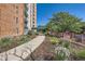 Landscaped walkway leading to the building entrance at 955 Eudora St # 204E, Denver, CO 80220