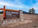 Elk Meadow Park entrance sign with trailhead info at 31719 Rocky Village Dr # 309, Evergreen, CO 80439