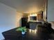 Modern kitchen with black countertops and appliances at 2710 W 86Th Ave # 49, Westminster, CO 80031