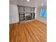 Spacious living room with hardwood floors and a built-in fireplace at 3006 S Fenton St, Denver, CO 80227