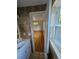 Bathroom with a view into a bedroom and hardwood floors at 3006 S Fenton St, Denver, CO 80227