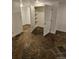 Basement with tile floors and built-in shelving at 3006 S Fenton St, Denver, CO 80227