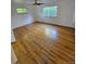 Bright bedroom with hardwood floors and large windows at 3006 S Fenton St, Denver, CO 80227