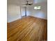 Large bedroom with hardwood floors and a ceiling fan at 3006 S Fenton St, Denver, CO 80227