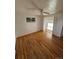 Bedroom with hardwood floors and access to a sunroom at 3006 S Fenton St, Denver, CO 80227