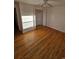 Bright bedroom with hardwood floors and a closet at 3006 S Fenton St, Denver, CO 80227