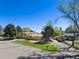Ranch style home with a large backyard and mature trees at 580 S Parfet St, Lakewood, CO 80226