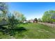 Expansive backyard with a view of the home and fence at 580 S Parfet St, Lakewood, CO 80226