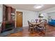 Dining area with stone fireplace and hardwood floors at 580 S Parfet St, Lakewood, CO 80226