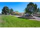 Spacious ranch home with a large front yard and mature trees at 580 S Parfet St, Lakewood, CO 80226
