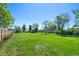Large, grassy backyard, partially fenced at 580 S Parfet St, Lakewood, CO 80226
