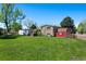 Large backyard with a hot tub and storage shed at 580 S Parfet St, Lakewood, CO 80226