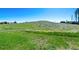 View of open grassy space with a hill in the background at 580 S Parfet St, Lakewood, CO 80226