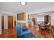 Open concept dining area with hardwood floors and kitchen access at 580 S Parfet St, Lakewood, CO 80226