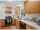 Modern kitchen with stainless steel appliances and light wood cabinets at 580 S Parfet St, Lakewood, CO 80226