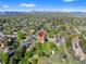 Aerial view of property showing house, yard, and neighborhood context at 580 S Parfet St, Lakewood, CO 80226