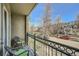 Private balcony with seating and view of tree-lined street at 1705 Gaylord St # 107, Denver, CO 80206