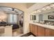 Double vanity bathroom with light wood cabinets and tile flooring at 1705 Gaylord St # 107, Denver, CO 80206