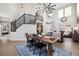 Elegant dining room with a rustic wooden table and a chandelier at 3908 S Lisbon Way, Aurora, CO 80013