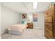 Cozy bedroom with a cheerful peach comforter at 1325 Clermont St, Denver, CO 80220