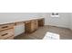 Built-in desk with light wood cabinets and ample storage at 5102 Hickory Oaks St, Castle Rock, CO 80104