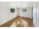 Well-lit bedroom with hardwood floors and large windows at 11852 Humboldt Dr, Northglenn, CO 80233