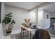Bright dining area with table and chairs near entryway at 14218 E 1St Dr # A05, Aurora, CO 80011