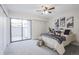 Bright bedroom with sliding glass doors to a private patio at 14218 E 1St Dr # A05, Aurora, CO 80011