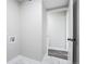 Simple laundry room with washer/dryer hookups and white painted walls at 14218 E 1St Dr # A05, Aurora, CO 80011
