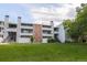 Building exterior showcasing landscaping and a grassy area at 14218 E 1St Dr # A05, Aurora, CO 80011