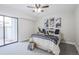 Bright bedroom with sliding glass doors leading to a private patio at 14218 E 1St Dr # A05, Aurora, CO 80011