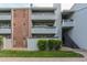 Brick building exterior with gray accents and landscaping at 14218 E 1St Dr # A05, Aurora, CO 80011