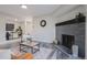 Open living space with fireplace and dining area view at 14218 E 1St Dr # A05, Aurora, CO 80011