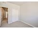 Bedroom with double door closet and access to hallway at 446 Millwall Cir, Castle Pines, CO 80108